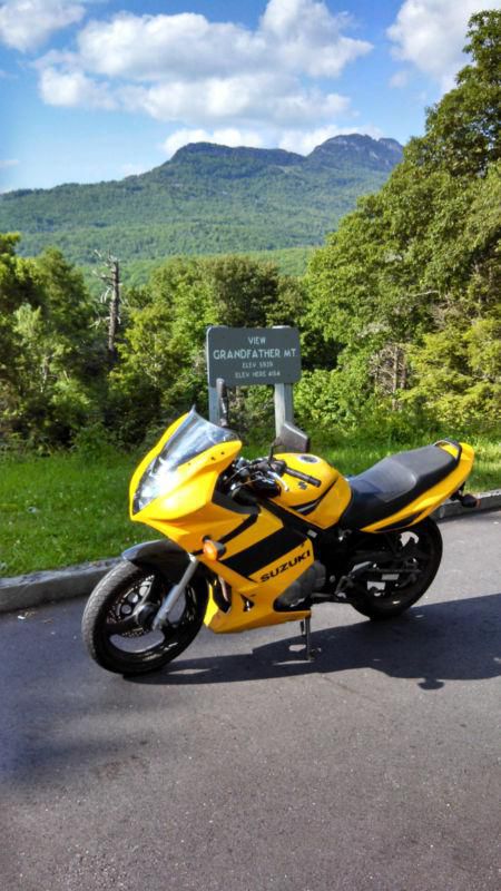2004 yellow Suzuki GS 500 motorcycle